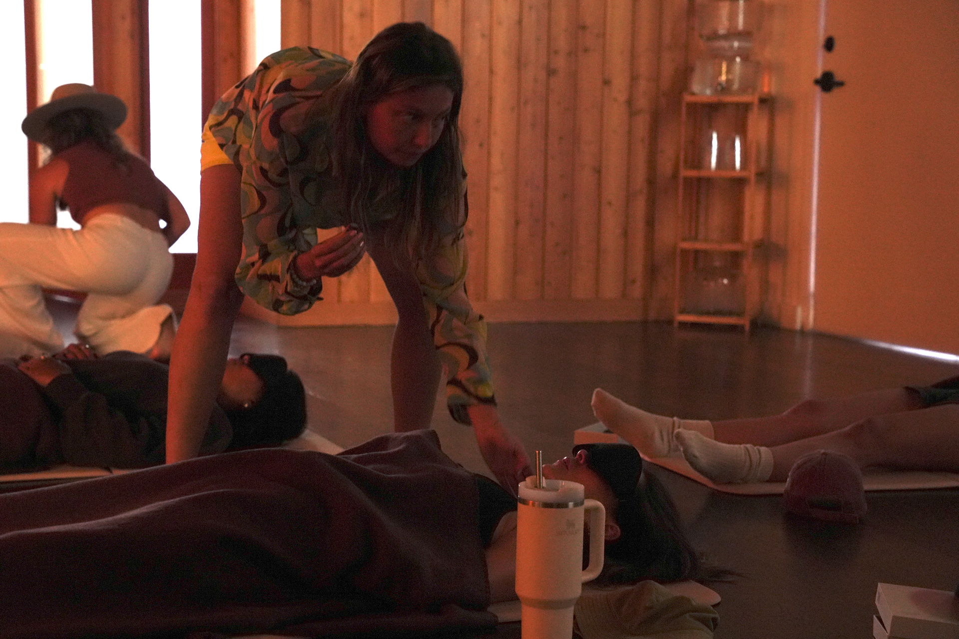 Talia guiding a participant during a breathwork session