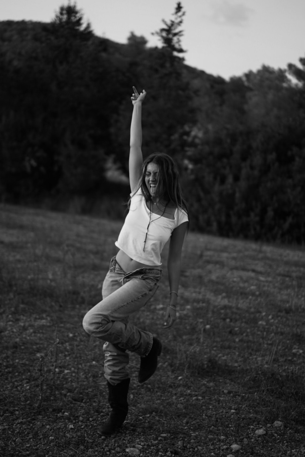 Talia dancing freely in a golden field